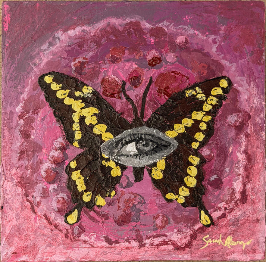 vibrant Butterfly painting with black and white eye painted in the middle